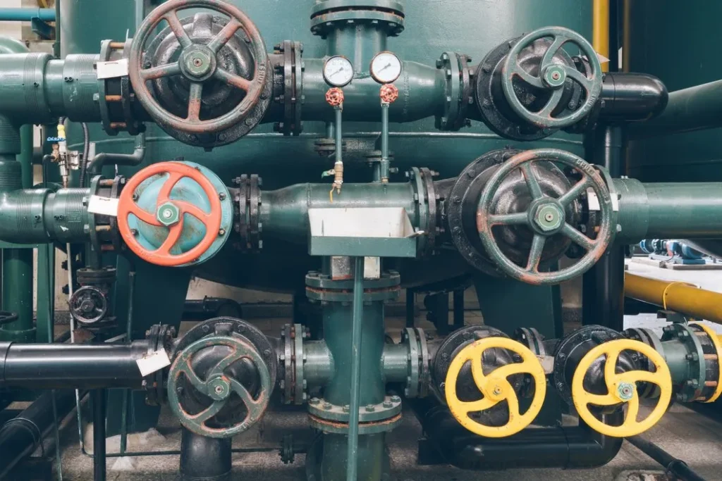 engineer inspecting industrial valve - home intro